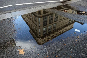 Abstracts Gallery: The offices of British life insurer Prudential are reflected in a puddle in London