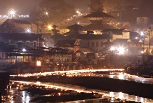 Oil lamps illuminate the Bagmati River in the Pashupatinath Temple Oil lamps illuminate the Bagmati River in the Pashupatinath Temple