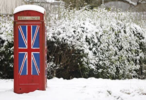 Images Dated 19th January 2013: An old telephone box painted with the Union Flag stands out in the snow at Staplefield