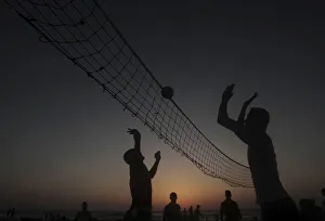 Palestinians play volleyball during the sunset at the sea of Gaza City Palestinians play volleyball during the sunset at the sea of Gaza City
