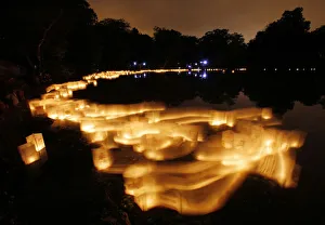 Paper lanterns float on Lake Hibiscus during the Forest Hills Lantern Festival at the Paper lanterns float on Lake Hibiscus during the Forest Hills Lantern Festival at the