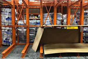 Partially empty shelves for plywood are seen at a Home Depot store ahead of the arrival Partially empty shelves for plywood are seen at a Home Depot store ahead of the arrival