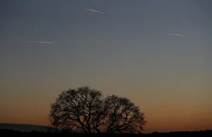 Passenger planes leave behind contrails as they fly in the skies over London Luton Passenger planes leave behind contrails as they fly in the skies over London Luton