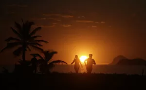 Images Dated 31st January 2014: People exercise in Barra da Tijuca beach during the sunrise in Rio de Janeiro