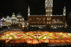 People gather around a giant flower carpet at Brussels Grand Place People gather around a giant flower carpet at Brussels Grand Place