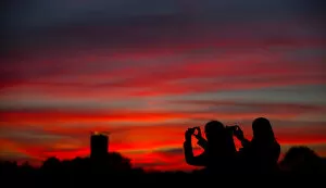 Images Dated 27th October 2014: People take pictures of sunset in Berlin