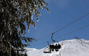 People ride a ski lift at the Mzaar Ski Resort in Kfardebian People ride a ski lift at the Mzaar Ski Resort in Kfardebian