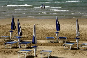 People spend their time by the sea at Rajska (Paradise) beach in Lopar, Rab island People spend their time by the sea at Rajska (Paradise) beach in Lopar, Rab island