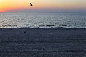Images Dated 28th April 2012: People stroll on the beach at the dawn in the Black Sea resort of Mamaia