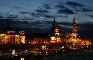 People stroll along the embankment of the Elbe river in Dresden People stroll along the embankment of the Elbe river in Dresden