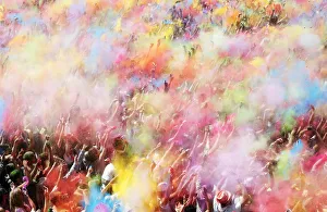 People throw coloured powder during the Holi festival in Barcelona People throw coloured powder during the Holi festival in Barcelona