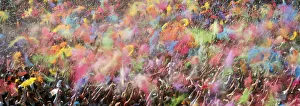 People throw coloured powder during the Holi festival in Barcelona People throw coloured powder during the Holi festival in Barcelona
