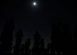 Darkness Gallery: People wait to watch a lunar eclipse at the open air skydeck of Roppongi Hills Tower in