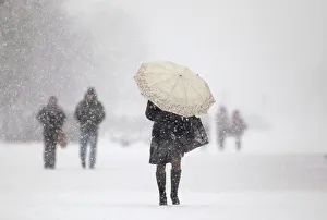 People walk during heavy snowfall in central Minsk People walk during heavy snowfall in central Minsk