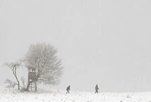 Images Dated 27th October 2012: People walk through a snowy landscape near the village of Dorndorf-Steudnitz