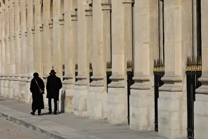 People walk on a warm spring morning in the Jardin du Palais Royal People walk on a warm spring morning in the Jardin du Palais Royal