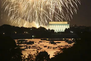 Images Dated 5th July 2013: People watch from boats on the Potomac River as Independence Day fireworks light the sky