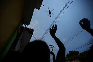 Images Dated 10th September 2017: People wave at a helicopter after an earthquake that struck off the southern coast of