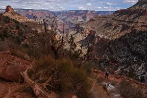 A person hikes on the Bright Angel Trail in the Grand Canyon near Grand Canyon Village A person hikes on the Bright Angel Trail in the Grand Canyon near Grand Canyon Village