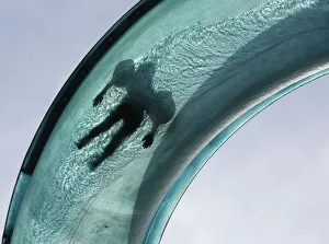 A person slides down a huge water pipe during a hot summer day in Vienna A person slides down a huge water pipe during a hot summer day in Vienna