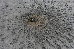 Piece of a mortar projectile is pictured on a road near the airport in Donetsk Piece of a mortar projectile is pictured on a road near the airport in Donetsk