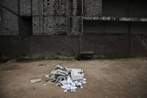 A pile of presidential and legislative ballot papers sit unattended a polling station in A pile of presidential and legislative ballot papers sit unattended a polling station in