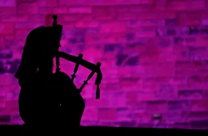 A piper plays a tune at Edinburgh Castle to herald the New Year during the Hogmanay A piper plays a tune at Edinburgh Castle to herald the New Year during the Hogmanay