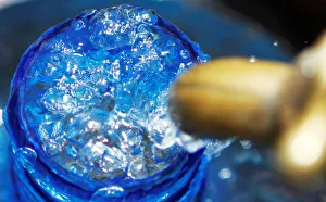 A plastic container is filled with water from a tap in Kawangware district of Nairobi A plastic container is filled with water from a tap in Kawangware district of Nairobi