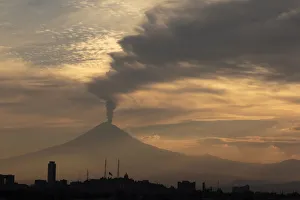 Puebla Gallery: Popocatepetl volcano spews a cloud of ash and steam high into the air in Puebla