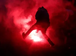 A protester approaches a flare at a protest march during the G7 Summit in Quebec City A protester approaches a flare at a protest march during the G7 Summit in Quebec City