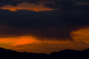 Rain starts to fall over the Sheep Mountain Range north of Las Vegas at sunset Rain starts to fall over the Sheep Mountain Range north of Las Vegas at sunset