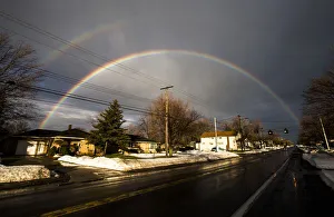Images Dated 24th November 2014: A rainbow forms over a neighbourhood following a massive snow storm in West Seneca