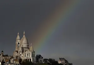A rainbow is seen against rain clouds above the Sacre Coeur Basilica on Montmartre after A rainbow is seen against rain clouds above the Sacre Coeur Basilica on Montmartre after
