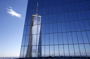 Reflection of the One World Trade Center tower is seen from a terrace on the 57th Reflection of the One World Trade Center tower is seen from a terrace on the 57th
