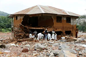 Rescue workers are seen searching through rubbles around a house for bodies at Pentagon Rescue workers are seen searching through rubbles around a house for bodies at Pentagon