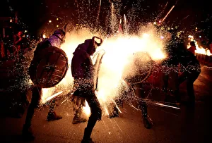Revellers dressed as devils walk among fireworks during Correfocs in Palma de Mallorca Revellers dressed as devils walk among fireworks during Correfocs in Palma de Mallorca