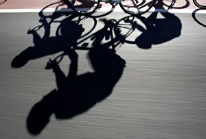 Riders cast shadows as they cycle during the third stage of the Mallorca Challenge Riders cast shadows as they cycle during the third stage of the Mallorca Challenge