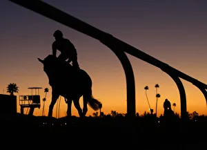 Riders take part in workout at dawn for the Breeders Cup horse race at Santa Anita Riders take part in workout at dawn for the Breeders Cup horse race at Santa Anita