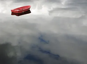 A rowing boat floats as clouds are reflected on Loch Linnhe in Fort William A rowing boat floats as clouds are reflected on Loch Linnhe in Fort William