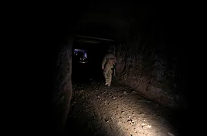 Russian soldier walks inside a tunnel that was used by rebels in Jobar, eastern Ghouta Russian soldier walks inside a tunnel that was used by rebels in Jobar, eastern Ghouta