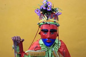 A Salvadoran dancer known as Historiante poses for a photo during a religious festival A Salvadoran dancer known as Historiante poses for a photo during a religious festival