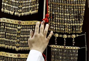 Images Dated 22nd December 2015: Saudi man displays jewellery at a store in Riyadh