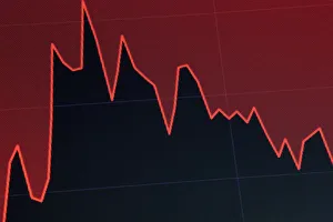 A screen displays a chart that tracks the Dow Jones Industrial Average on the floor at A screen displays a chart that tracks the Dow Jones Industrial Average on the floor at