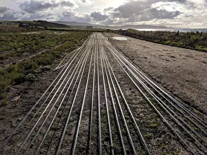 Seawater irrigation pipework runs along the ground on an experimental farm on the west Seawater irrigation pipework runs along the ground on an experimental farm on the west
