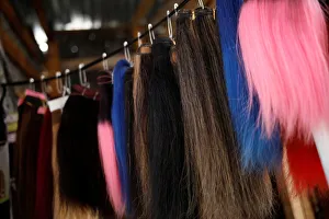 A set of fake wigs are displayed for sale at a street stand in Port-au-Prince A set of fake wigs are displayed for sale at a street stand in Port-au-Prince
