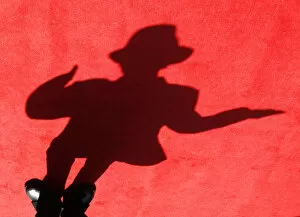 Images Dated 28th October 2009: A shadow of a dancer impersonating Michael Jackson is cast on the red carpet during