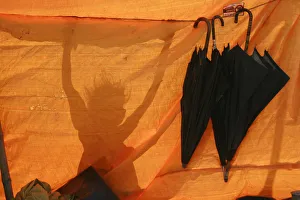 A shadow of a girl is seen outside her makeshift tent in the flood-hit area of Darbhanga A shadow of a girl is seen outside her makeshift tent in the flood-hit area of Darbhanga