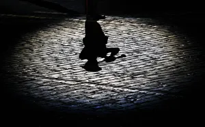 The shadow of a participant is cast onto the ground during the International Military The shadow of a participant is cast onto the ground during the International Military