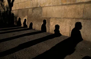 Shadows of people queuing to vote are cast on a wall during voting in Catalonia's Shadows of people queuing to vote are cast on a wall during voting in Catalonia's