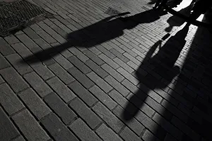 The shadows of workers are seen in the City of London financial district, London, Britain The shadows of workers are seen in the City of London financial district, London, Britain
